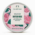 A circular tin of The Body Shop British Rose Body Butter 400ml on soft background