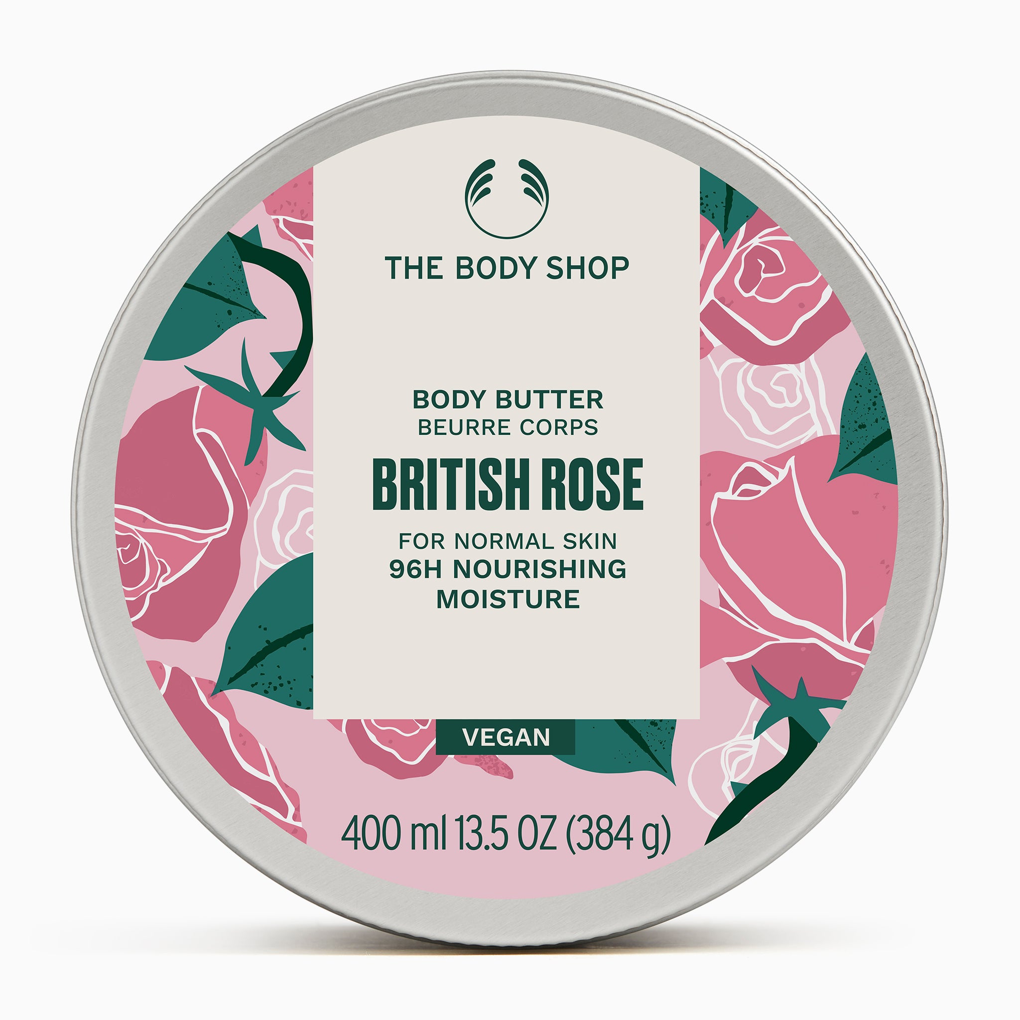 A circular tin of The Body Shop British Rose Body Butter 400ml on soft background