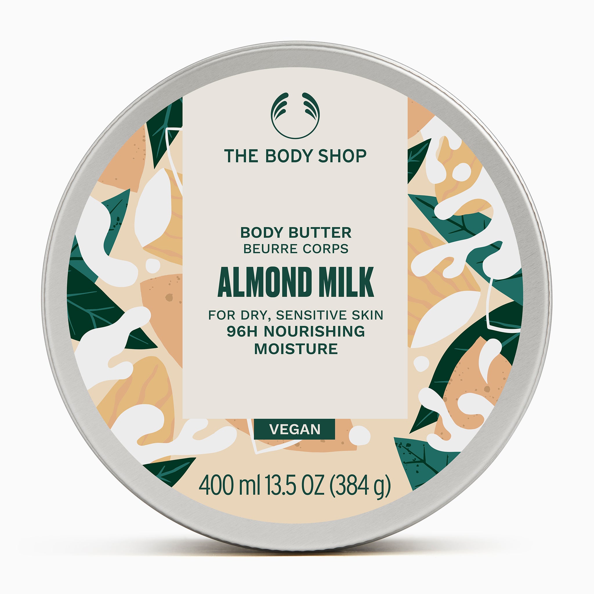 A round container of The Body Shop Almond Milk Body Butter 400ml against a clean, uniform background