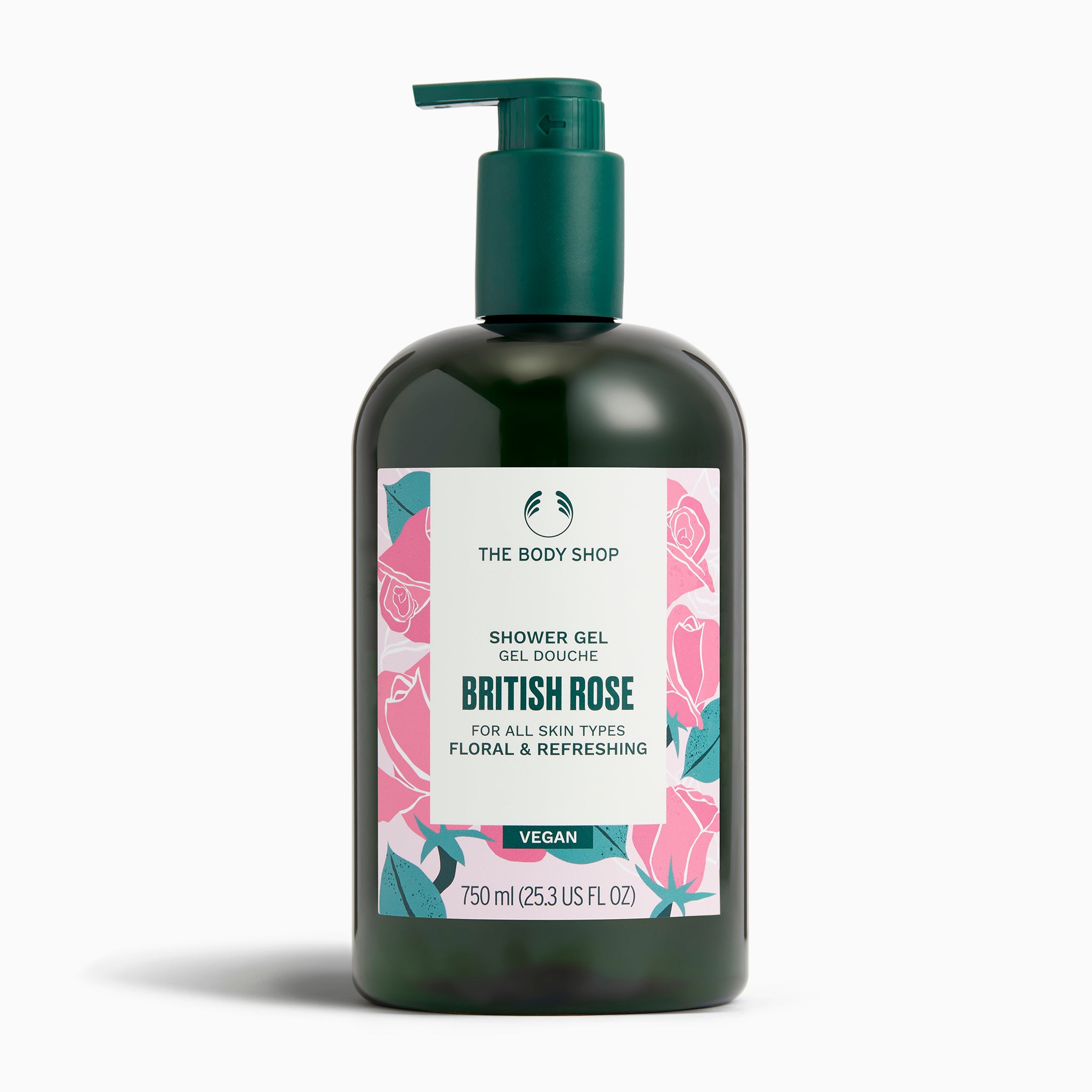 A bottle of The Body Shop British Rose Shower Gel 750 ML with floral packaging against a clean surface.