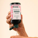 Hands dispensing The Body Shop British Rose Shower Gel 250ml, showing product texture against soft background.