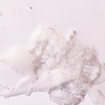 Close-up of bubbles from British Rose Shower Gel 250 ML on clean white surface