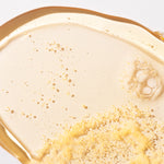 Close-up of Mango Shower Gel 250ml showcasing bubbly texture on clean surface