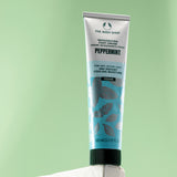 The Body Shop Peppermint Invigorating Foot Cream 100 ML against soft green background emphasizing cooling properties