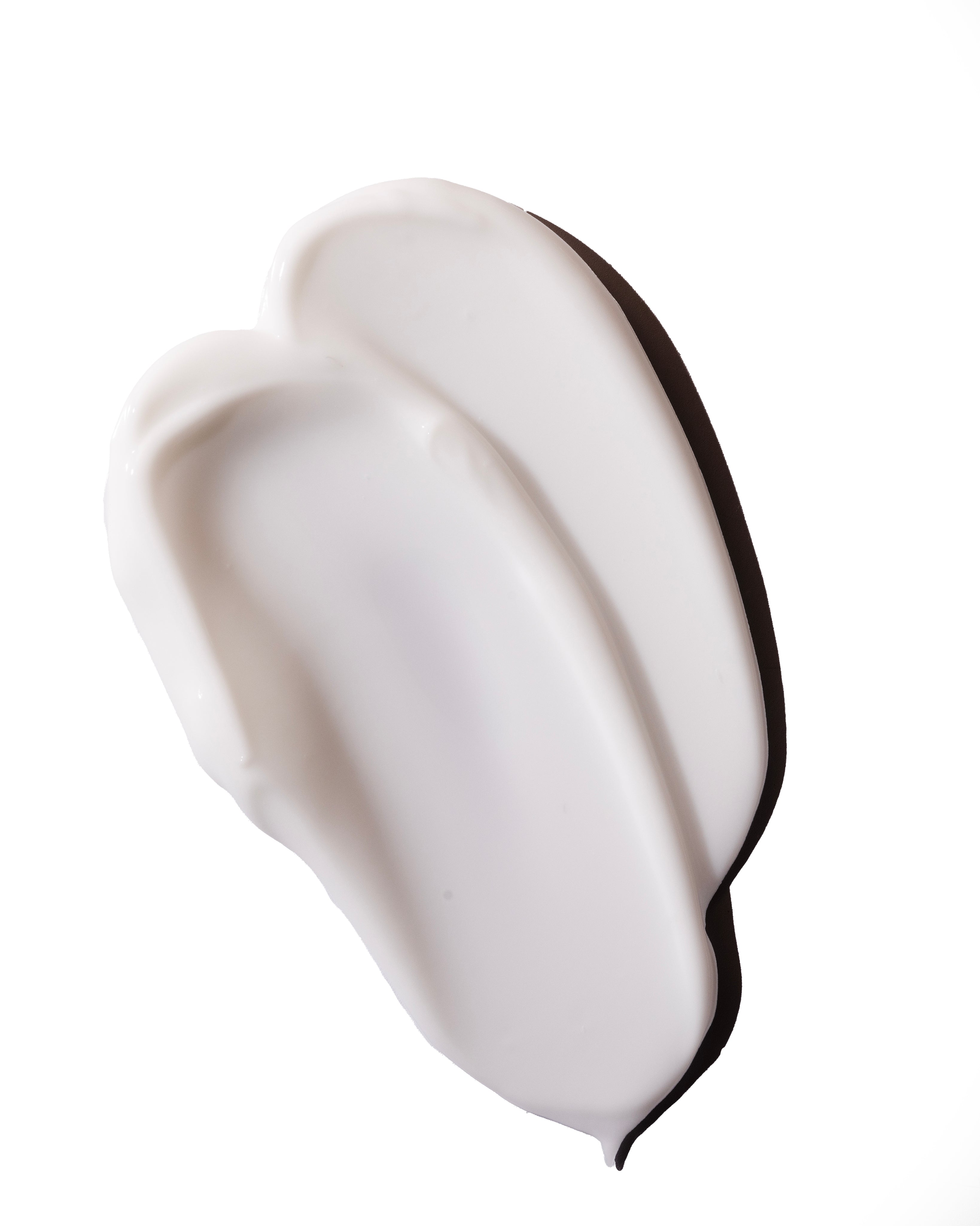 Creamy texture of Vitamin E Cream Cleanser 250 ML on clean white background