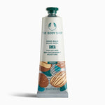 The Body Shop Shea Hand Balm 30 ML for dry skin, featuring nourishing moisture, displayed on a clean background.