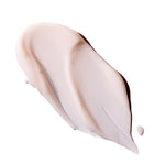 Smooth, creamy texture of British Rose Hand Cream 30ml on a textured surface