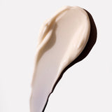 Close-up of creamy Shea Body Lotion 200 ML spread on a clean surface, showcasing its texture.