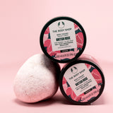 Two containers of The Body Shop British Rose Body Yogurt 200ml on a pink backdrop