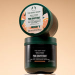A stacked view of The Body Shop Pink Grapefruit Body Yogurt 200 ML on a light-colored pedestal.