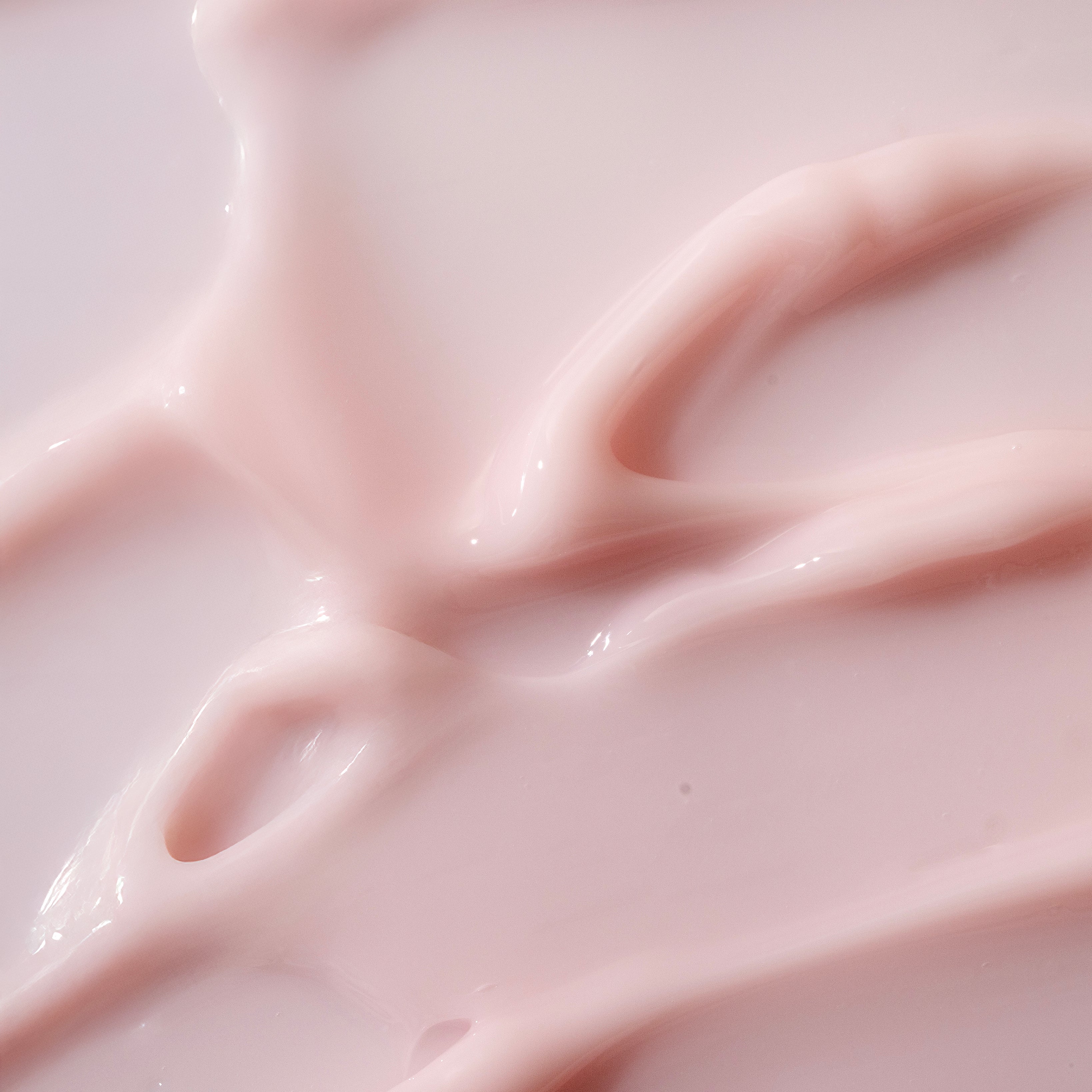 Close-up of Pink Grapefruit Body Yogurt 200ml, highlighting its creamy texture against a white background.