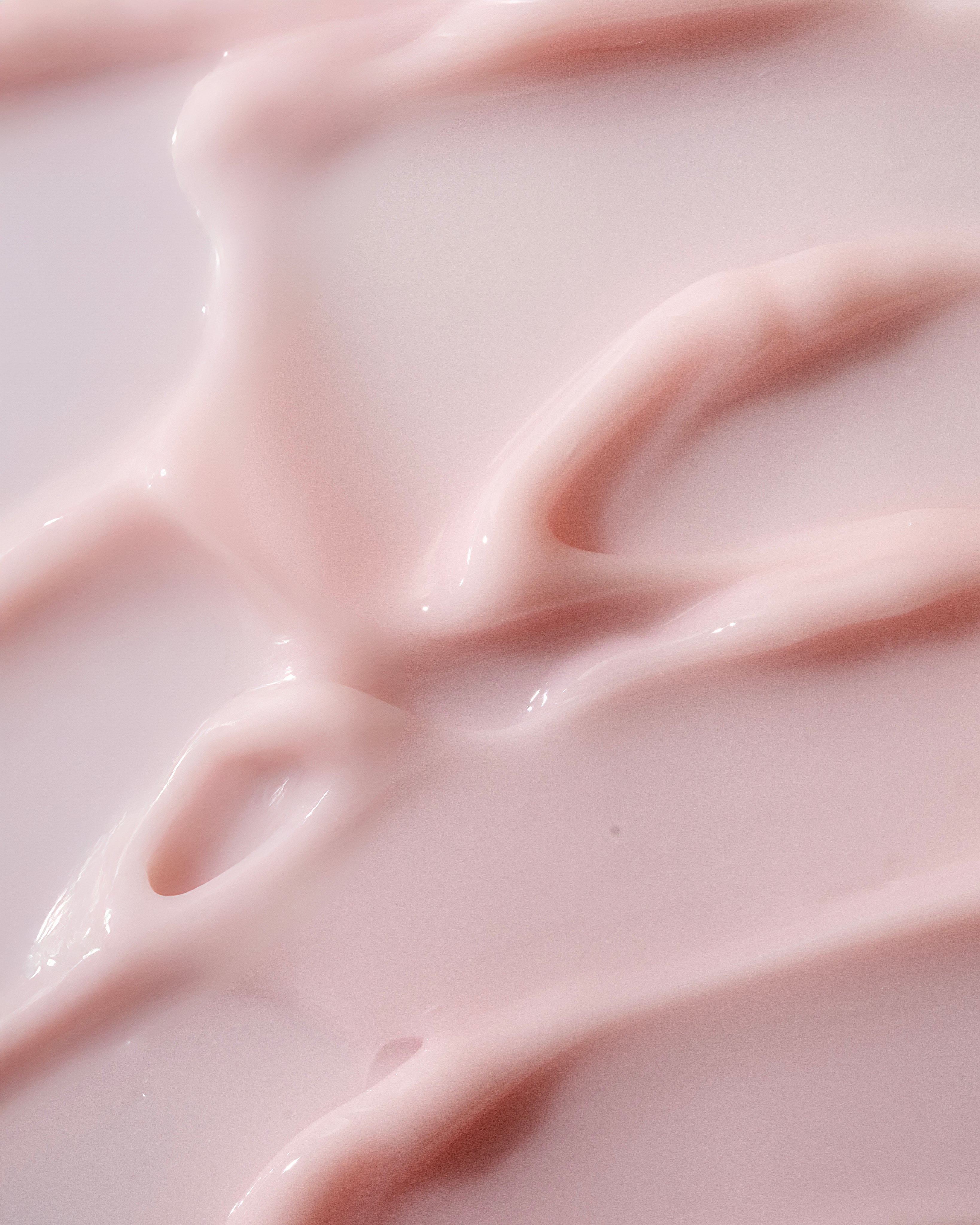 Close-up of Pink Grapefruit Body Yogurt 200ml, highlighting its creamy texture against a white background.