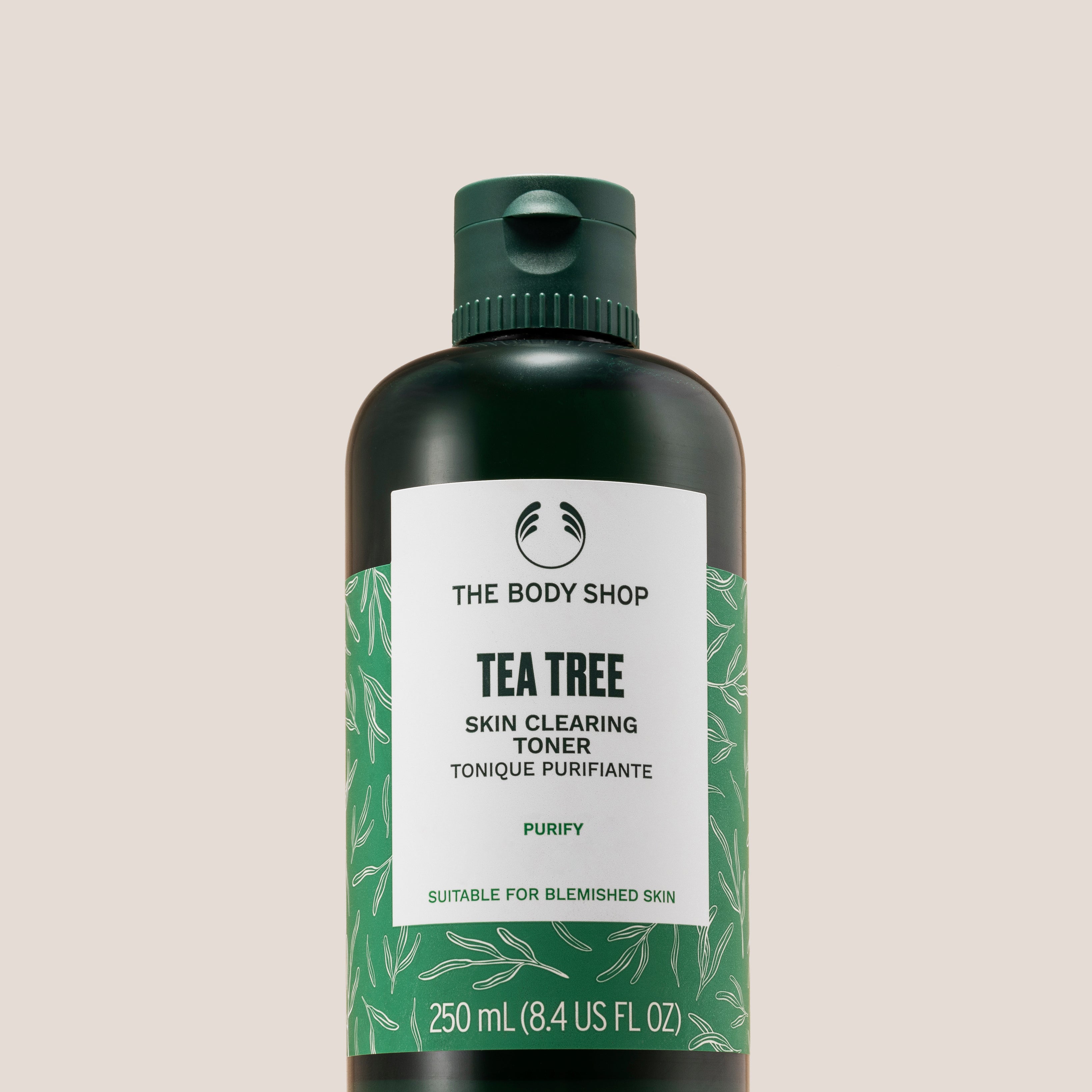 The Body Shop Tea Tree Skin Clearing Toner 250ml displayed on a clean pedestal against a soft background