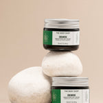 Stylish arrangement of The Body Shop Edelweiss Smoothing Day Cream 50 ML on smooth stones against soft beige backdrop