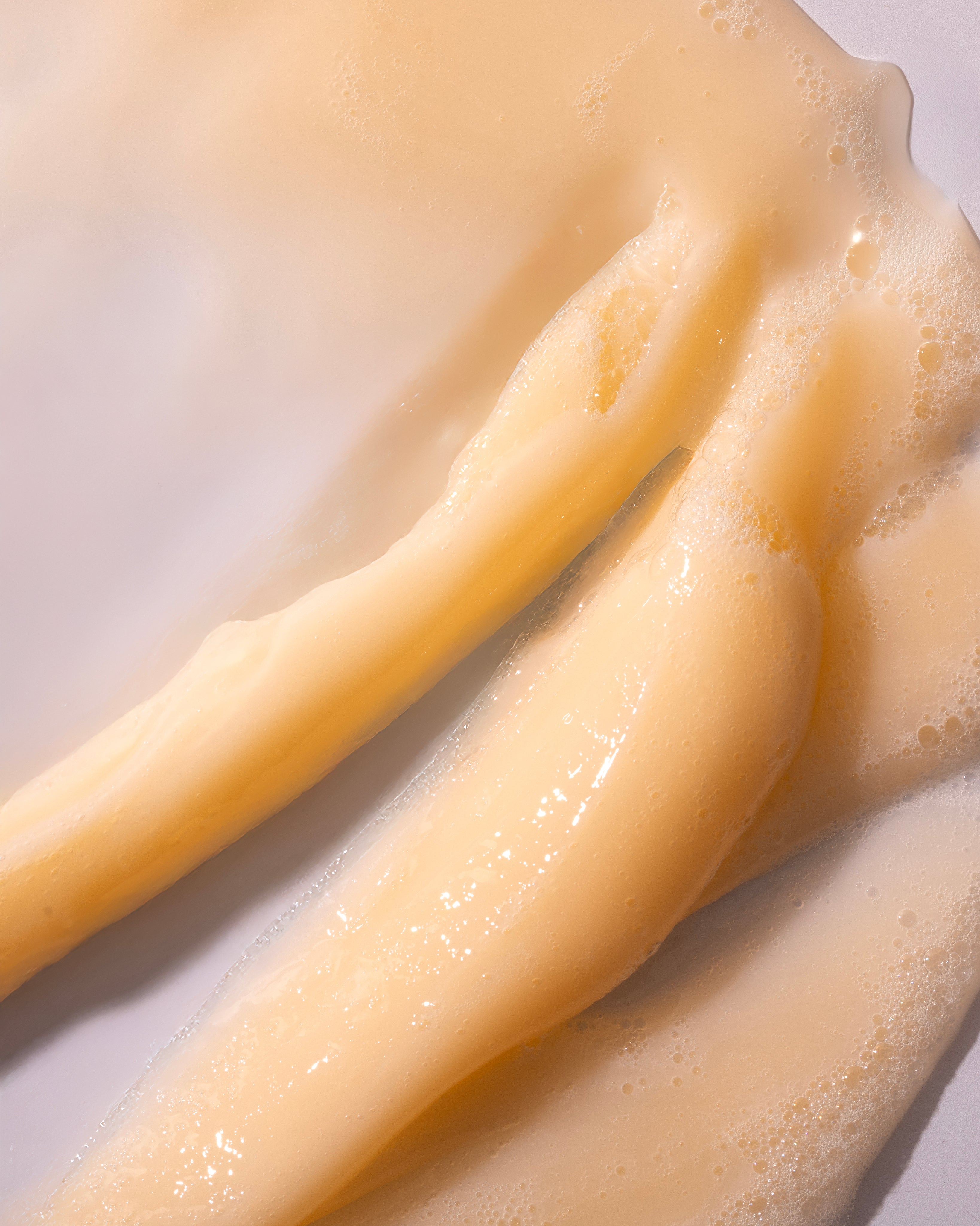 Close-up of Shea Intense Repair Shampoo 250 ML showing creamy texture and bubbles against a clean white background.