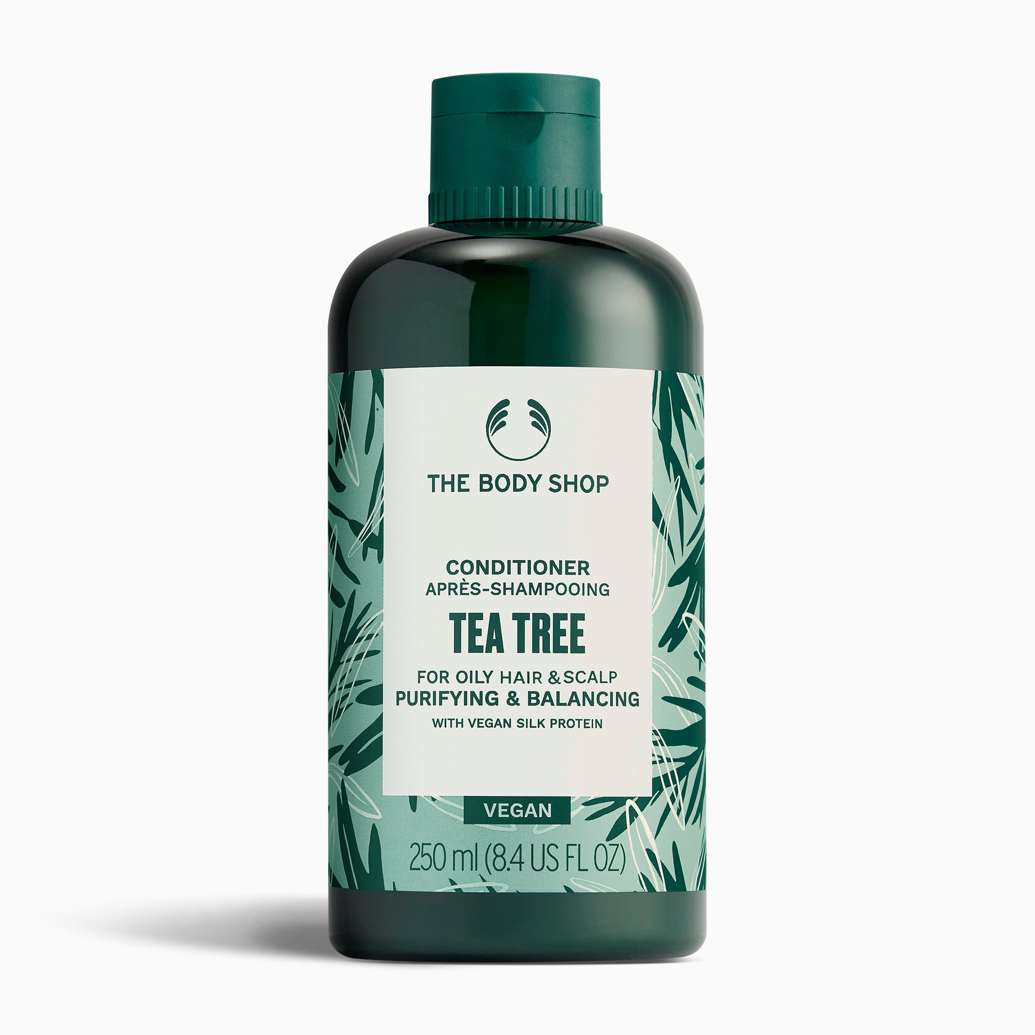 Bottle of The Body Shop Tea Tree Conditioner 250 ML on clean white background