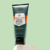 Guarana & Coffee Energising Moisturiser For Men 100 ML on white block against green background