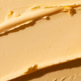 Close-up view of creamy mango body butter 200ml showcasing its rich texture against a soft background