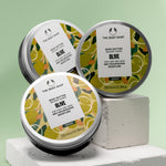 Arranged Olive Body Butter tins 200 ML by The Body Shop against pastel green background