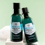 Pair of The Body Shop Maca Root & Aloe Calming Post-Shave Water Gel For Men 160 ML against light green background