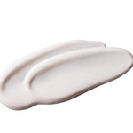Close-up of Vitamin E Gentle Face Wash 125 ML showcasing creamy texture against smooth white background.