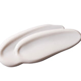 Close-up of Vitamin E Gentle Face Wash 125 ML showcasing creamy texture against smooth white background.
