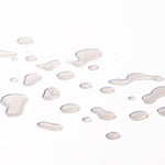Close-up of liquid droplets resembling Vitamin E Moisturising Toner 250 ML against a soft background.