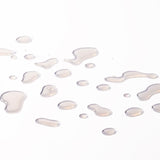 Close-up of liquid droplets resembling Vitamin E Moisturising Toner 250 ML against a soft background.