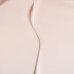 Close-up of The Body Shop Vitamin E Day cream with a subtle gradient.