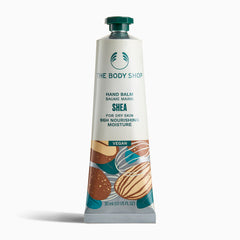 The Body Shop Shea Hand Balm 30 ML for dry skin, featuring nourishing moisture, displayed on a clean background.