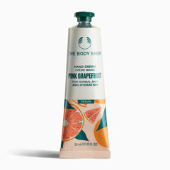 The Body Shop Hand Cream Crème Mains Pink Grapefruit 30ml on clean background highlighting vibrant packaging