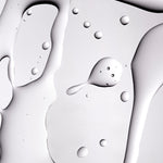 Close-up image showcasing smooth gel texture with droplets, reflecting light on studio backdrop