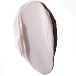 Close-up of smooth, creamy Almond Milk Body Lotion 200ml against a white background