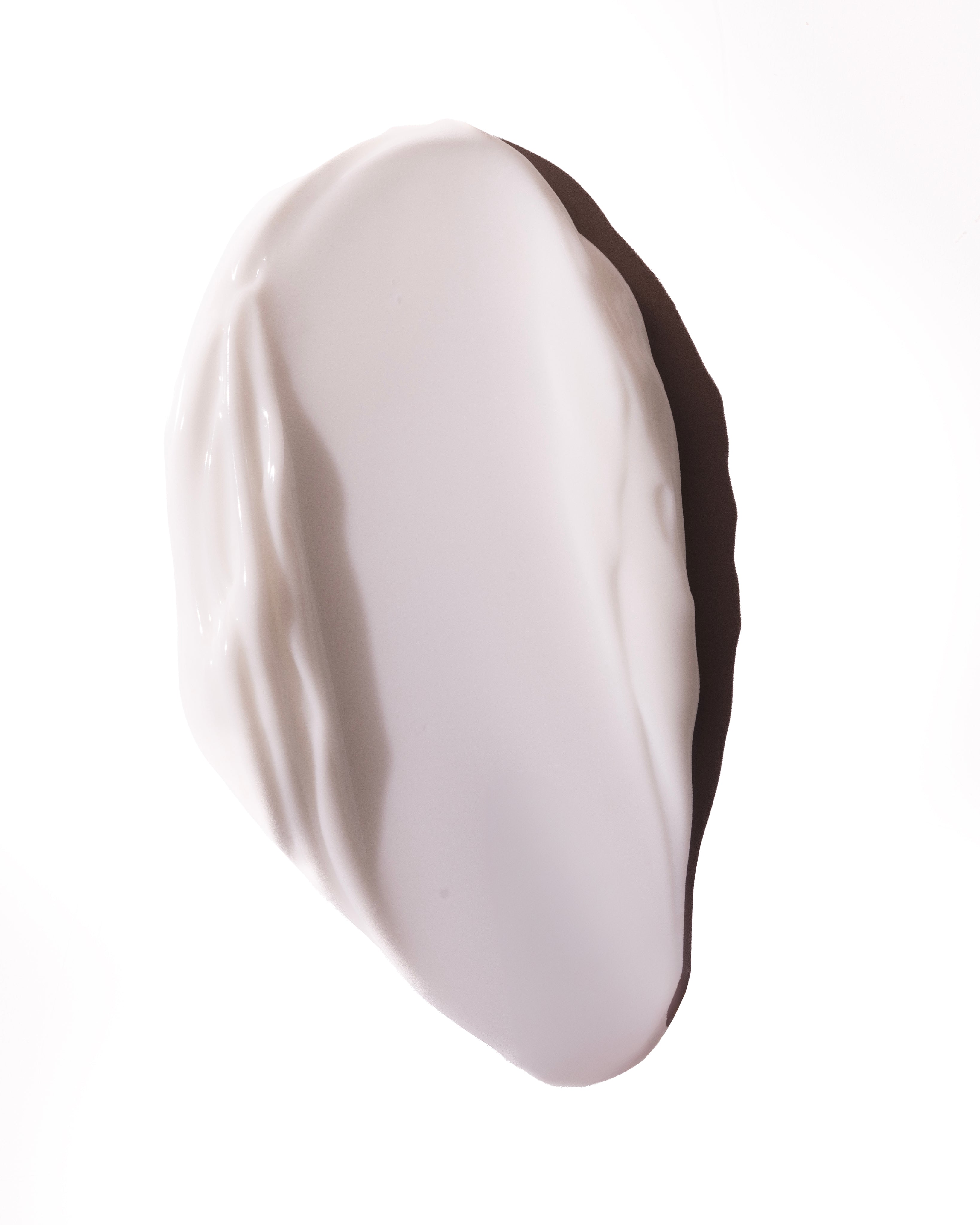Close-up of smooth, creamy Almond Milk Body Lotion 200ml against a white background