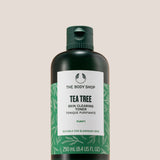The Body Shop Tea Tree Skin Clearing Toner 250ml displayed on a clean pedestal against a soft background
