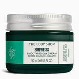 Edelweiss Smoothing Day Cream 50 ML in dark green jar on a sleek surface, designed for elegant presentation.