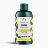 A bottle of The Body Shop Banana Smooth & Shine Conditioner 250ml against a clean background.