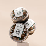 Three jars of The Body Shop Coconut Body Butter 200ml arranged on a clean surface, showcasing vibrant packaging.