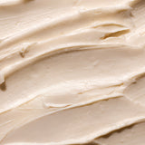 Close-up of creamy Shea Body Butter, showcasing its smooth texture