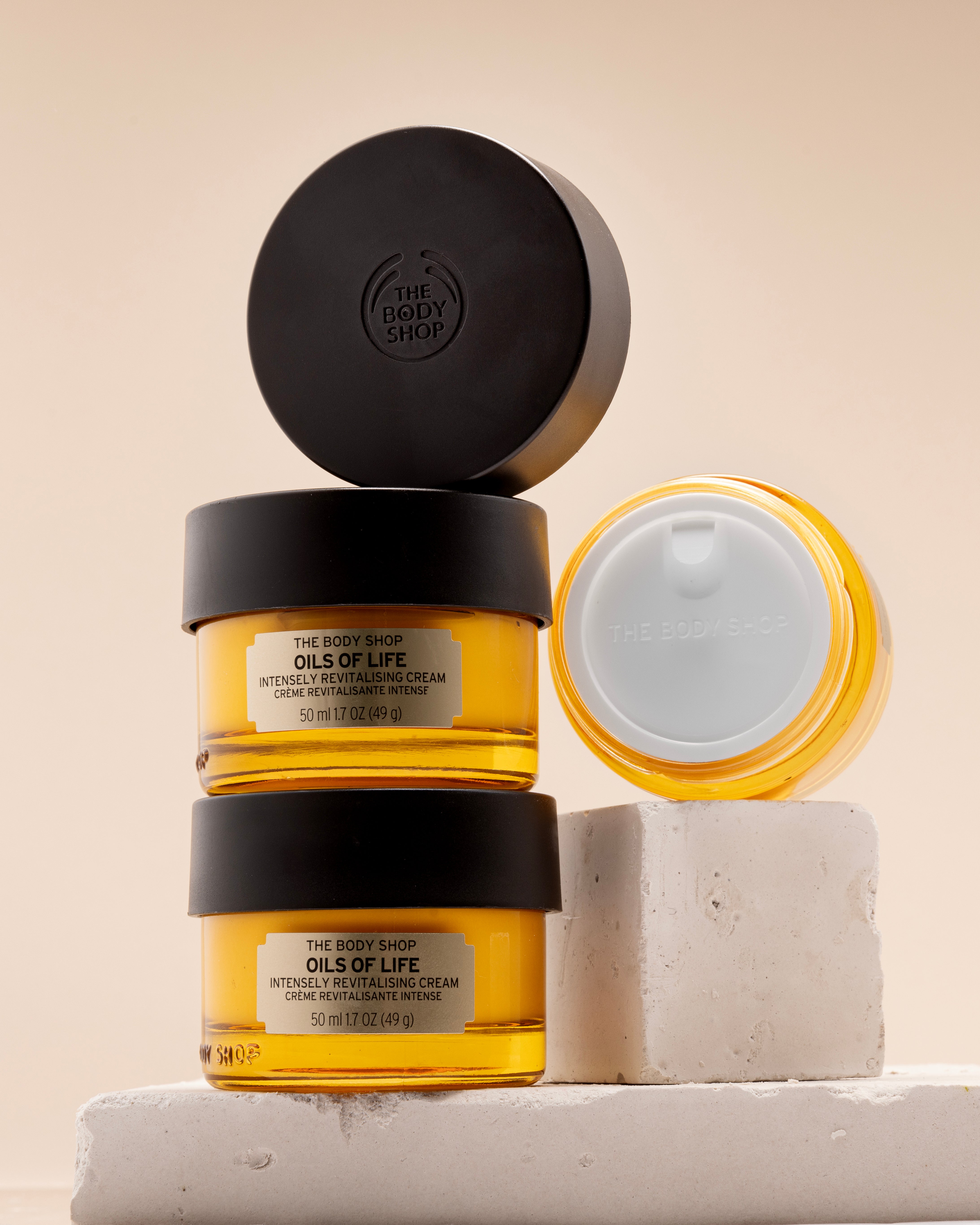 The Body Shop 'Oils of Life' skincare products on a neutral background